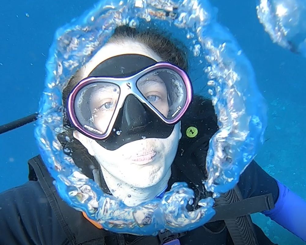 hannah blowing a bubble ring underwater